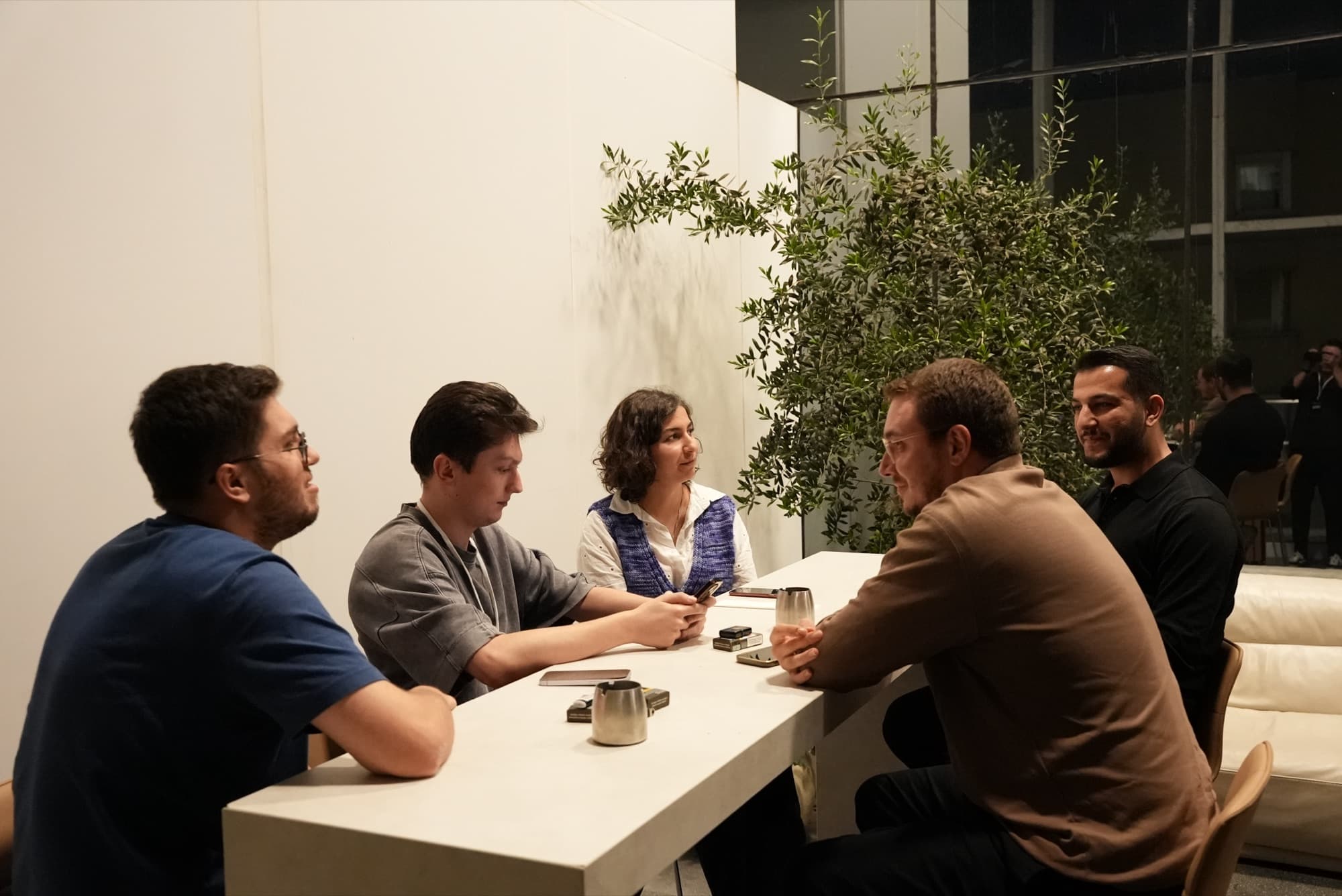 A small group talking around a table