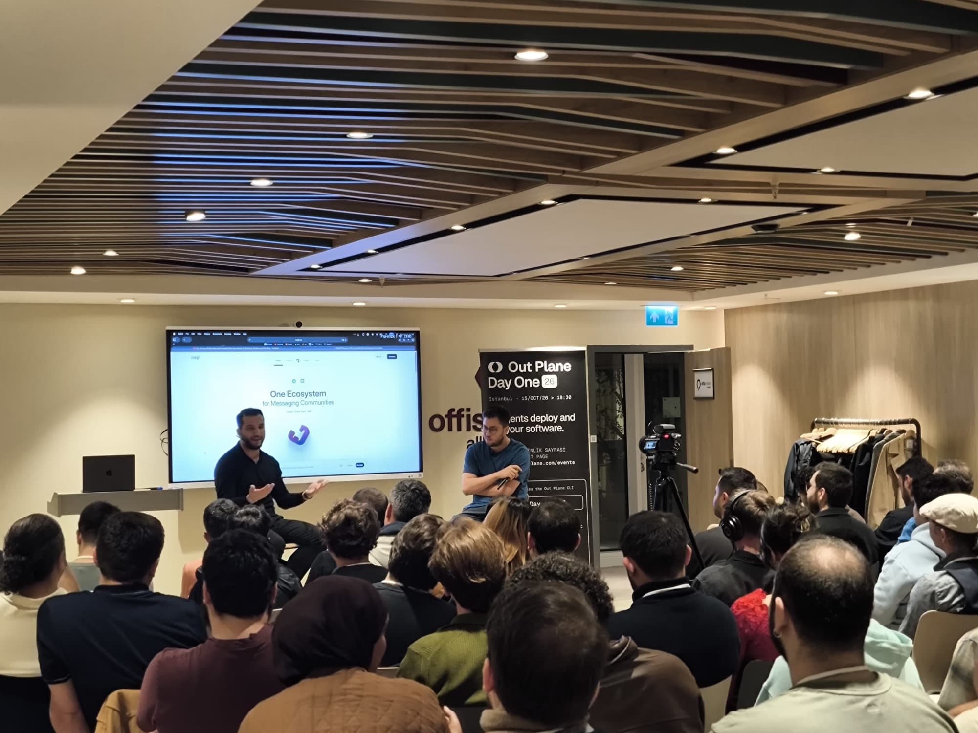 A full room listening to a fireside session